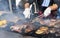 Chef grilling meat during cookout picnic or food event. Meat mix variety, Labour Day, 1 Mai