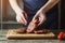 Chef hands cooking meat steak. Chef adding salt and pepper on raw meat. Cooking beef steak on wooden board