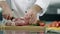 Chef hands cutting meat at kitchen. Closeup man chef hands cutting pork fillet