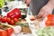 Chef Hands Cutting Red Hot Chili Pepper Halves