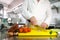 Chef hands cutting vegetables