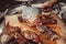 Chef Hands cutting whole grilled pork for steaks with knife on cutting board. Hot Meat dishes.