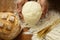 Chef hands with dough and homemade natural organic bread and flour