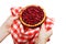 Chef hands hold freshly baked tartlet with cherry