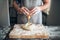 Chef hands mix dough with egg, bread preparation