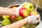 Chef hands washing apples.