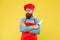 Chef handsome bearded cook in red uniform hold sharp professional knife