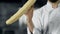 Chef having fun with french bread at kitchen. Closeup man hands play with bread