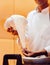 Chef holding Papadum dough, Indian food appetizer