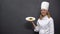 Chef holding plate with pasta, delicious Italian food recipes, culinary arts