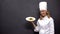 Chef holding plate with pasta, delicious Italian food recipes, culinary arts