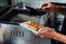 Chef is holding a plate of Yaki-Gyoza set Japanese Pan-Fried Dumplings after cooked. Hot, fresh, juicy and tasty