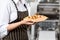 Chef Holding Tray With Stuffed Ravioli Pasta Sheet