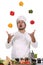 Chef juggling with peppers