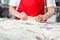 Chef Kneading Dough In Commercial Kitchen