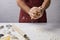 Chef kneading dough in hands