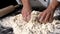 Chef kneading ingredients together to form a dough