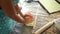 Chef kneads the steep dough on the table next to the rolling pin