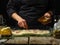 The chef lays out the olives on the prepared dough for the classic Italian focaccia bread. The ingredients are nearby. Simple