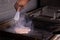 Chef making flambe chicken breast