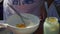 Chef making a sour cream with egg, soured with lemon juice