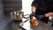 Chef making tasty burger. Cheeseburger with beef patty, cheese, tomato, onion.