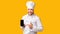 Chef Man Showing Smartphone Empty Screen Standing, Yellow Background, Mockup