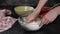 Chef mixing butter, sugar and flour with hands.