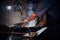 Chef mixing and frying flambe on a pan with steam in a restaurant kitchen