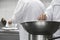 Chef Mixing Ingredients In Bowl