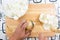 Chef peeling and chop onion before cooking with knife