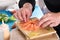 Chef plating up raw salmon for sashimi
