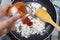 Chef pouring ketchup to pan for cook fried rice