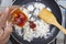 Chef pouring ketchup to pan for cook fried rice