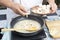 Chef pouring slice of mushroom cream soup