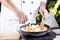 Chef pouring soup to the pan for cooking Japanese pork curry