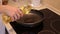 Chef pouring vegetable oil to the pan. Pouring vegetable oil into frying pan.