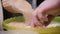 Chef pours brown sugar in dough. Stock footage. Closeup of chef pours and knead by hand liquid mixture for dough. Baking