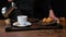 Chef prepares black coffee with croissants. Close-up 4k video shooting