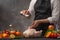 The chef prepares the chicken for baking, the process of salt, freeze in motion. For baking in the oven or BBQ. Vegetables and
