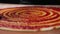 Chef prepares delicious traditional Italian pizza dish and spreads tomato sauce