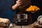 The chef prepares the diced pumpkin filling for the American Pumpkin Pie. He tosses the pumpkin into the pot. Ingredients. Close-