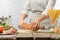 Chef prepares dough in a light kitchen with ingredients, culinary recipes, cooking bread, baking italian pasta.Restaurant and
