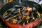 Chef prepares homemade pasta spaghetti with mussels and fresh cheese.