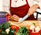 Chef prepares meal. Male hands cut mushroom with knife