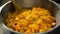 Chef prepares a pumpkin dish and adds a finely chopped orange skin close-up