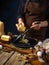 The chef prepares the pumpkin pie filling from the ingredients spread out on the table. He grates the pumpkin. Traditional