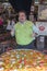 Chef prepares spanish seafood paella cooked in a large frying pan on street market restaurant , Bangkok, Thailand