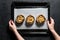 The chef prepares stuffed Portobello mushrooms.  Gray background. Top view. Space for text