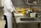 Chef preparing fruit in commercial kitchen